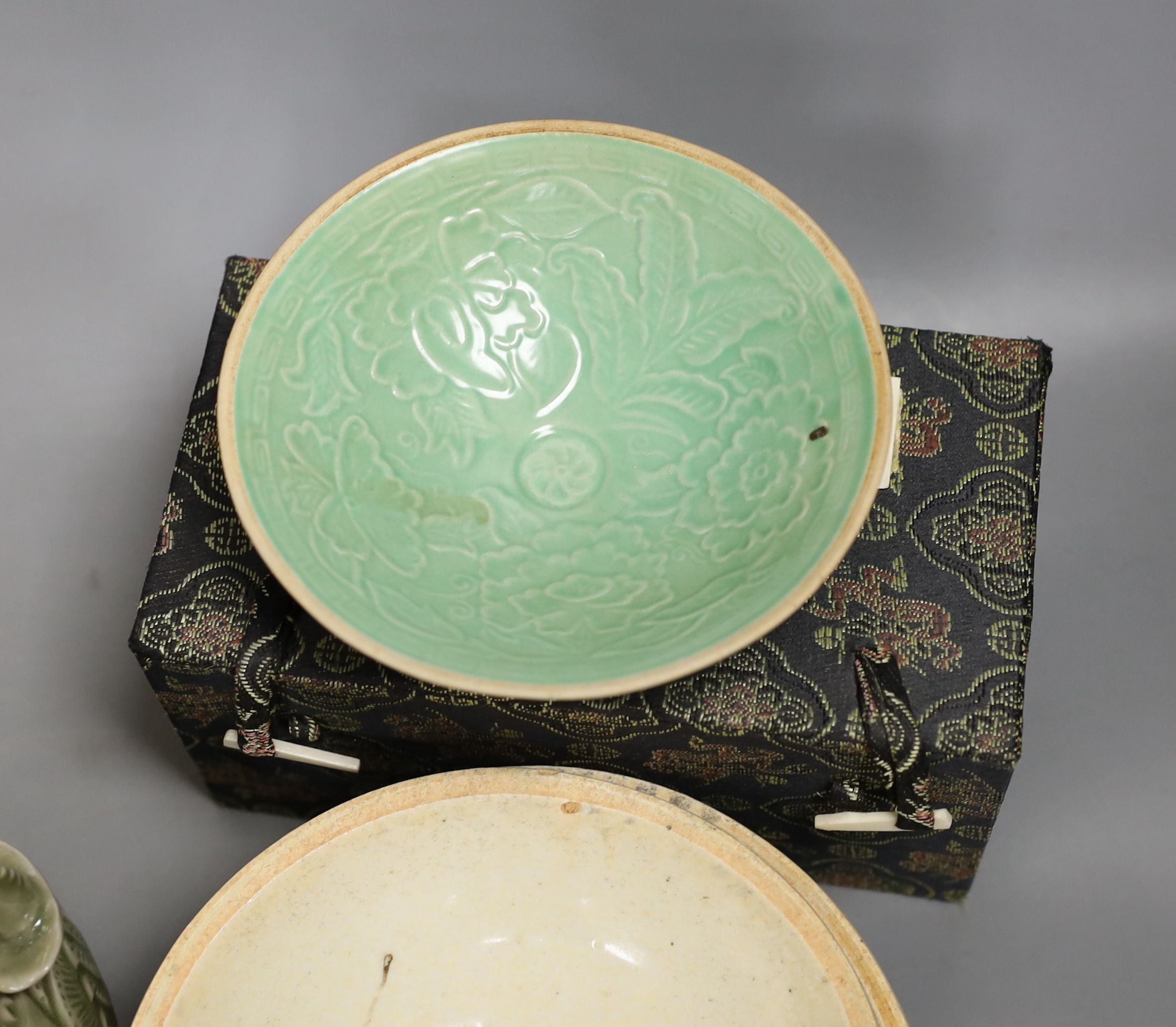 A group of Chinese celadon vessels and Qingbai type bowls, teapot 17 cms high.